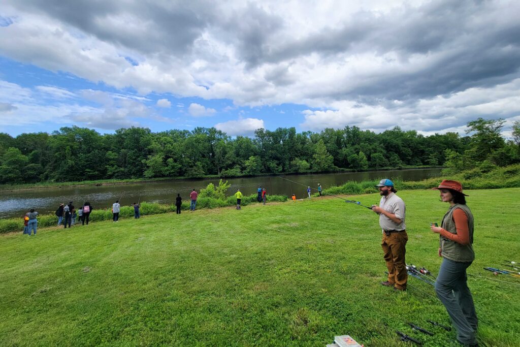 community fishing night along the banks of the anacostia river at the arboretum