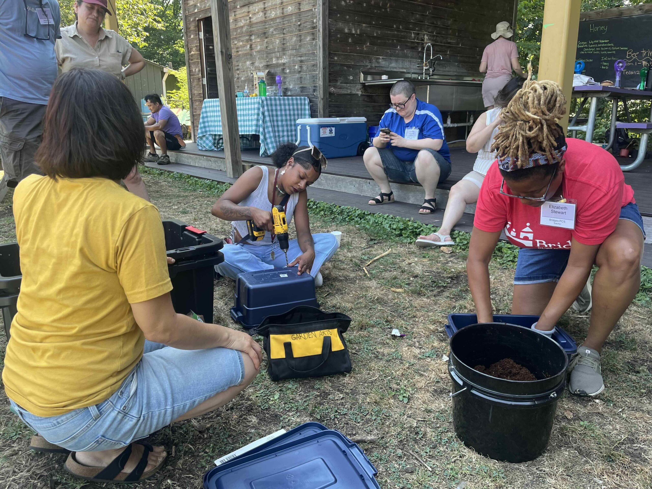 educators build their own worm bins during the 2024 summer institute