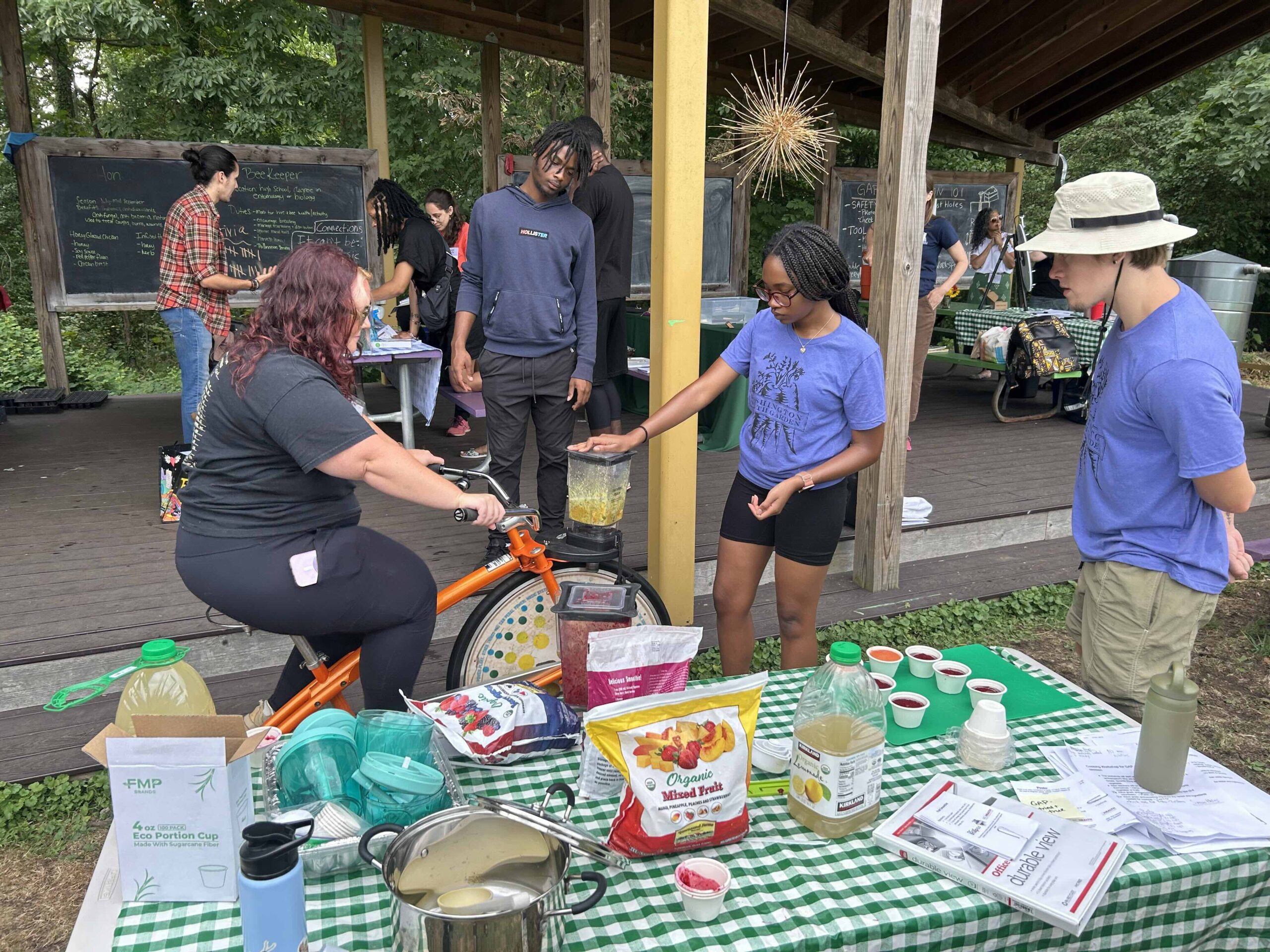 educators use the smoothie bike to blend up some food during the 2024 summer institute